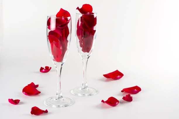 Beautiful red rose with stem on broken mirror for concept of a broken relationship or marriage