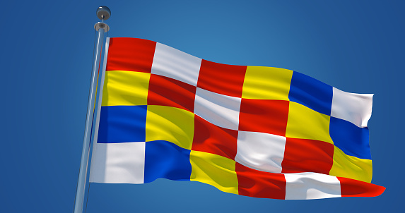Fluttering silk flag of Antwerp province, Belgium. Antwerp province official flag in the wind against clear blue sky. 3d render