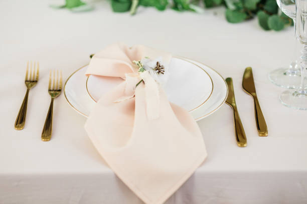 istock wedding table decorated by plates, knives and forks 1133969044
