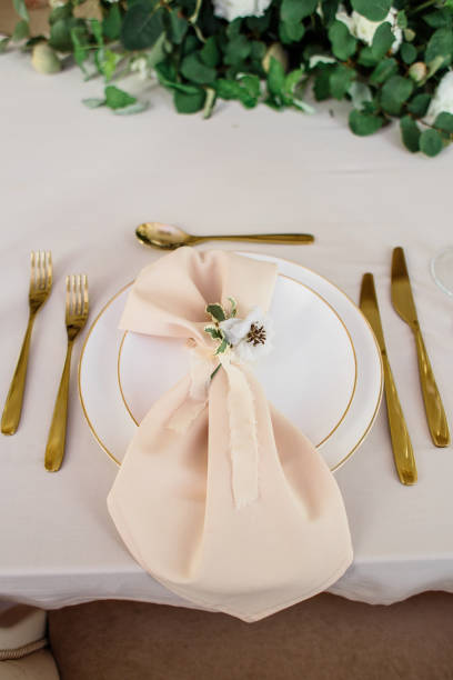 istock wedding table decorated by plates, knives and forks 1133969132
