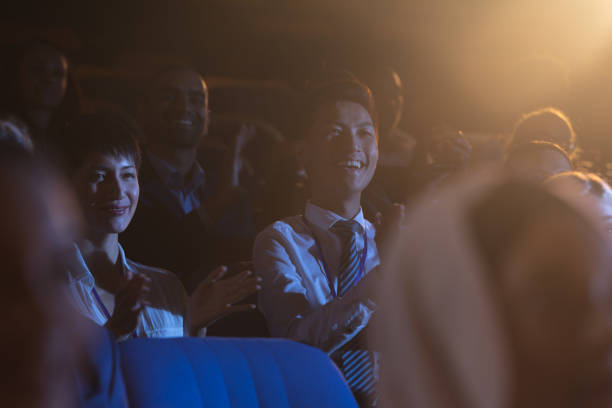 istock Business colleagues sitting and watching presentation with audience 1133973104