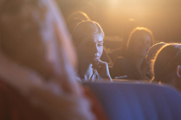 istock Businesswoman thinking and looking down while sitting in the auditorium 1133973153