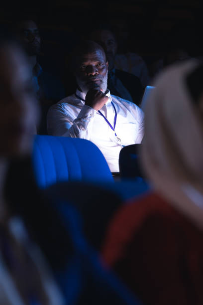 istock Businessman looking and thinking while sitting in the auditorium 1133973353