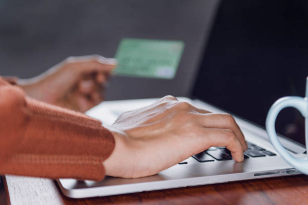 istock Picture of  Using the card over the Internet. Focus on the hand 1133974970