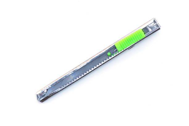 istock Green cutter knife isolated on white background. 1133976227