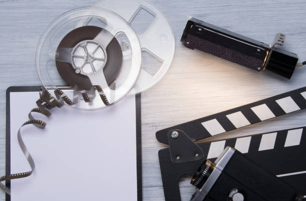istock on a light background, film, old video camera, double for shooting and a clean notebook, with space for writing 1133976570