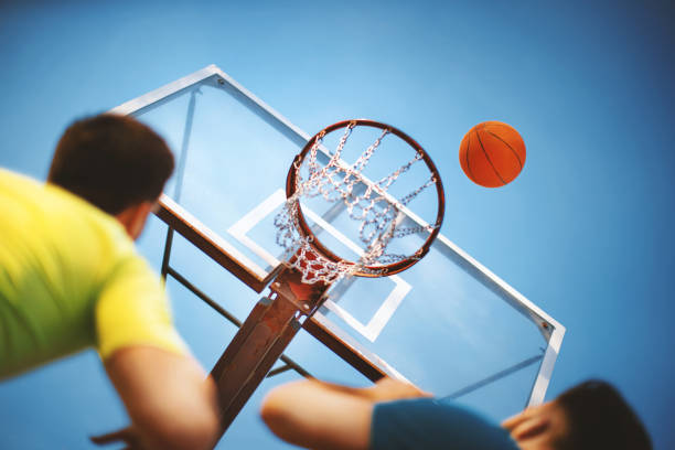 istock Shooting some hoops on a summer afternoon. 1133977254