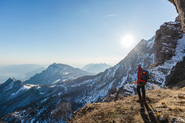 istock Alpinist looking at the mountain panorama 1133978500