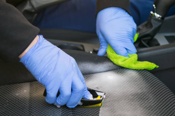 istock hands in blue rubber gloves, working on cleaning the car interior 1133978858