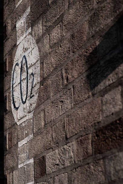 istock Weathered painted sign on a brick wall warning of CO2 outlet 1133979898
