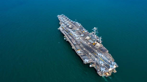istock Navy Nuclear Aircraft carrier, Military navy ship carrier full loading fighter jet aircraft, Aerial view. 1133980104