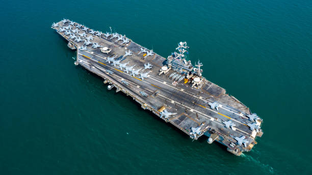 istock Navy Nuclear Aircraft carrier, Military navy ship carrier full loading fighter jet aircraft, Aerial view. 1133980120