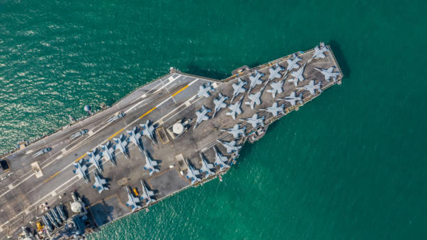 istock Navy Nuclear Aircraft carrier, Military navy ship carrier full loading fighter jet aircraft, Aerial view. 1133980155