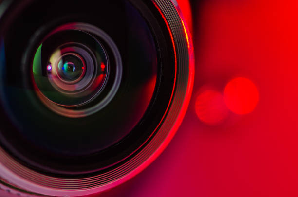 istock The camera lens and red backlighting . Horizontal photo 1133981367