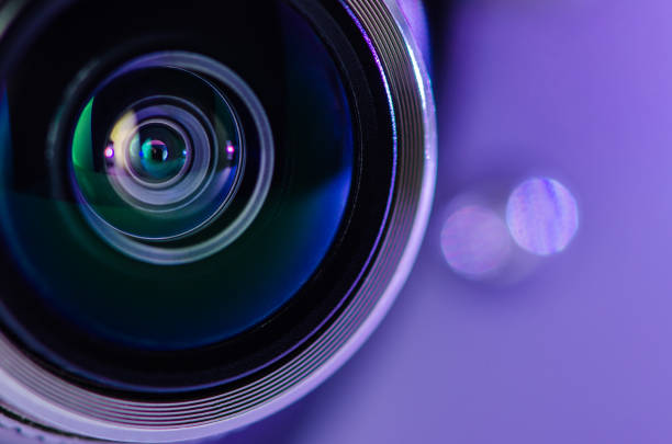 The camera lens and the beautiful light blue color . Horizontal photo
