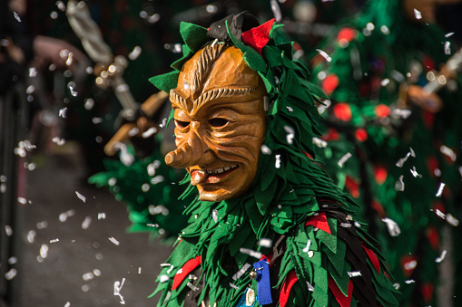 Venice, Italy - February 8, 2015: Closeup portrait of beautiful woman wearing colorful carnival mask