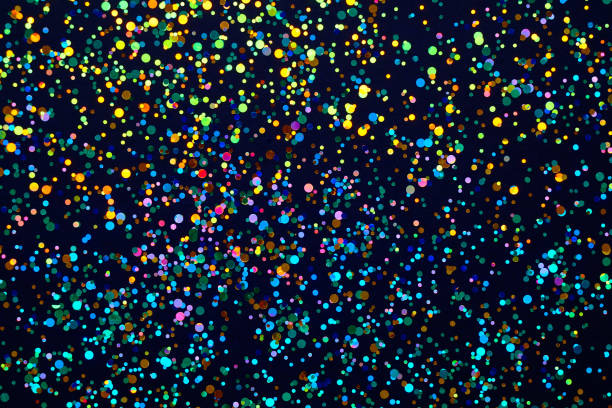 istock Glitter background. Christmas texture for your design and text. Multicolored sweets on a dark background 1133987468