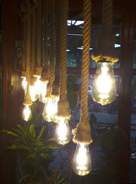 istock Cold-electric bulbs on a knitted string in retro style like luminaries 1133988199