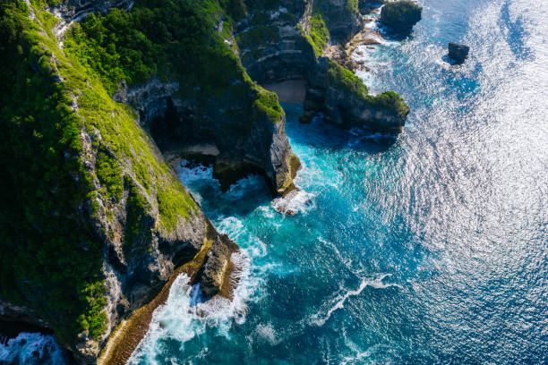 istock Blue ocean and cliffs. Bali shores from above. Aerial drone shot. 1133990896