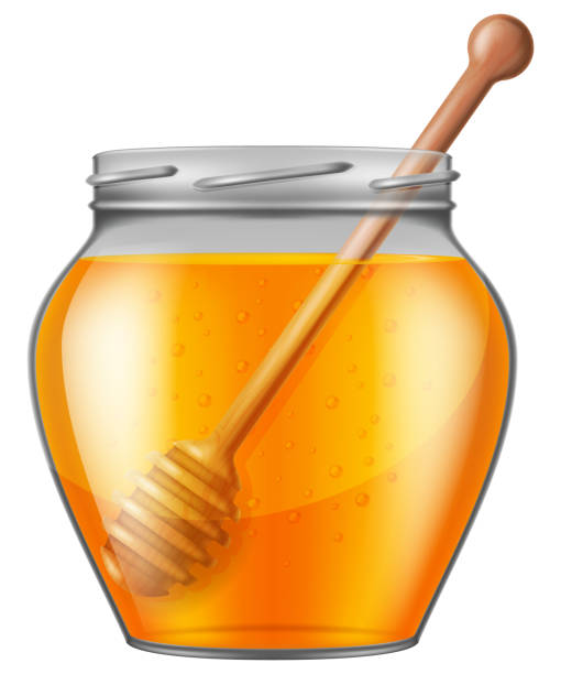 istock Jar of honey with wooden drizzler. 1133991080