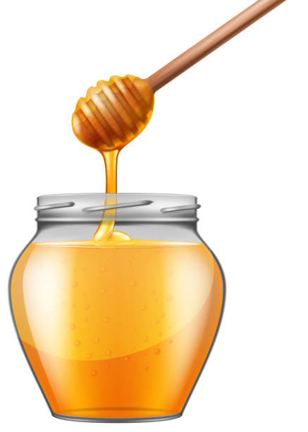istock Jar of honey with wooden drizzler. 1133991105