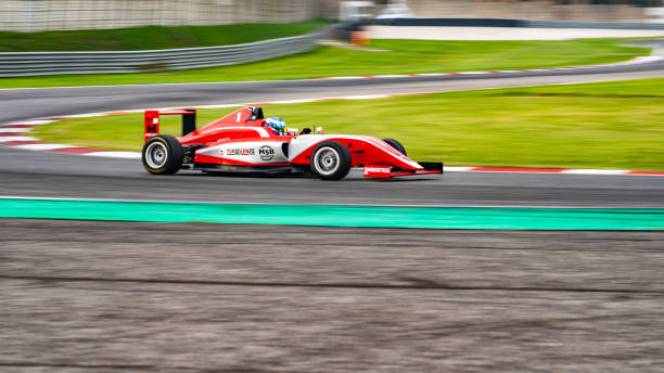 istock Man driving formula racing car 1133992322