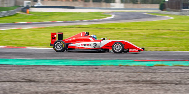 istock Man driving formula racing car 1133992325