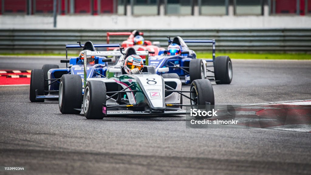 Car Racers Men Men Driving Formula Racing Cars Stock Photo - Download Image Now - Race ...