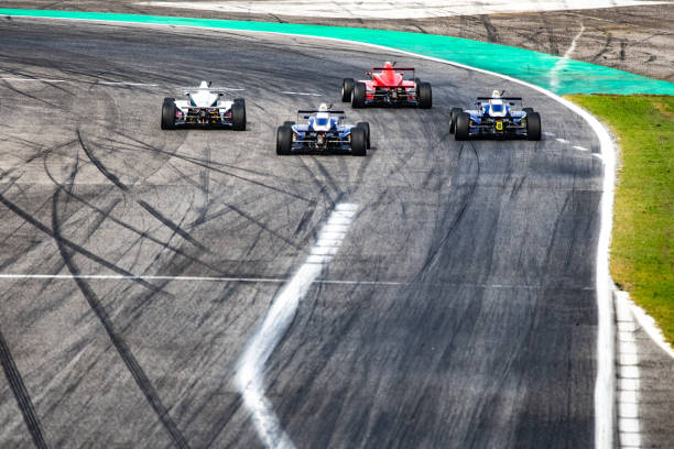 istock Men driving formula racing cars 1133992345