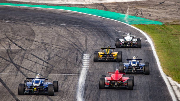 istock Men driving formula racing cars 1133992355