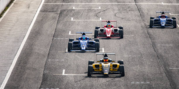 istock Men driving formula racing cars 1133992362