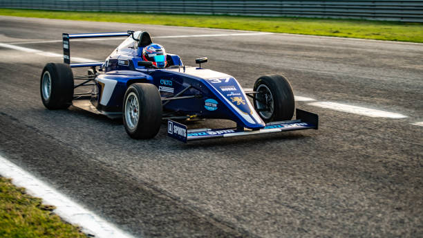 istock Man driving formula racing car 1133992388