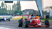 Man driving formula racing car