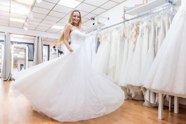 istock Princess bride dancing in bridal shop 1133993772