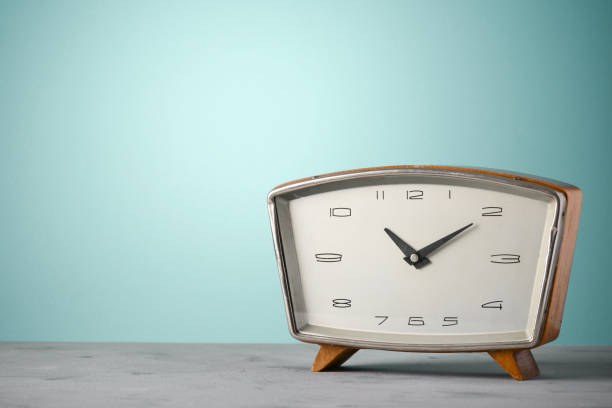 Retro old wooden clock on desk