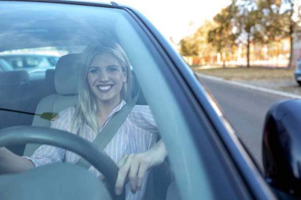 istock Attractive blonde girl observed through the windshield 1133994423