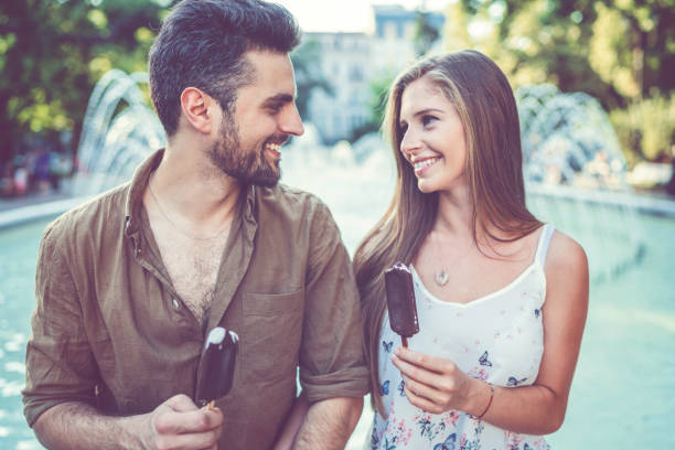 istock Young couple eating ice-creams 1133995959