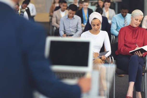 istock Business people writing notes at a business seminar 1133996008