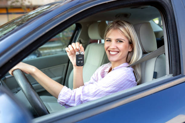 istock Young beautiful woman holding her car keys 1133996063