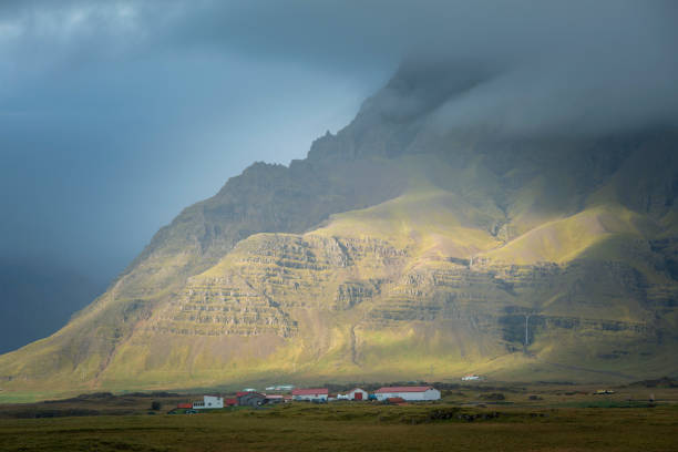 istock Icelandic farm in mountains. 1133997084