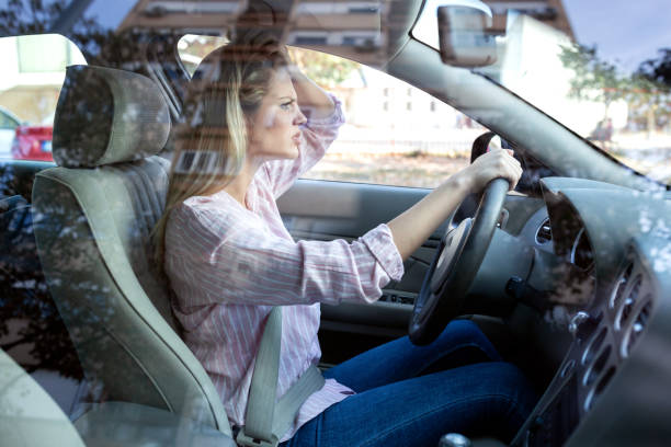 istock Young blonde woman losing her nerves while driving 1133997177