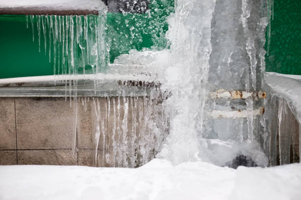 istock Long icicles fall from the roof on winter and early spring. 1133997301