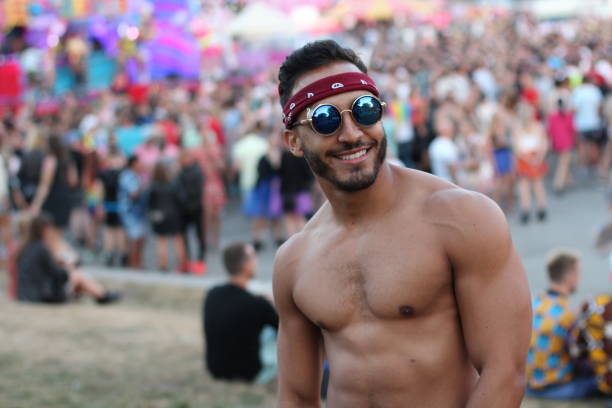 istock Muscular sexy man in the crowd 1133998609