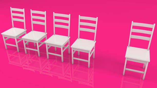 istock Row of white chairs on pink background 1133998652