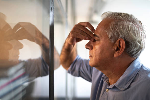 istock Frustrated senior businessman with headache at work 1134000459