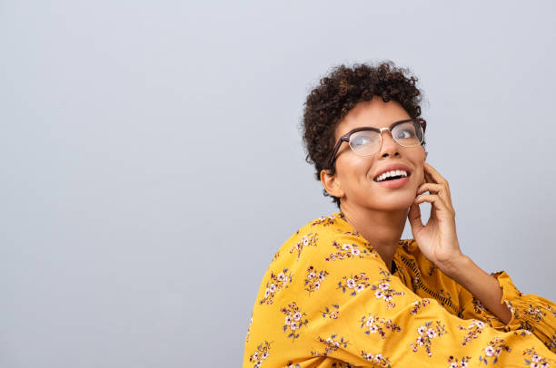African woman with eyewear thinking