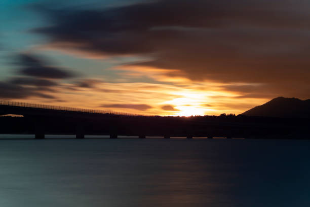 istock Nice sunset after a viaduct crossing over a lake 1134000684
