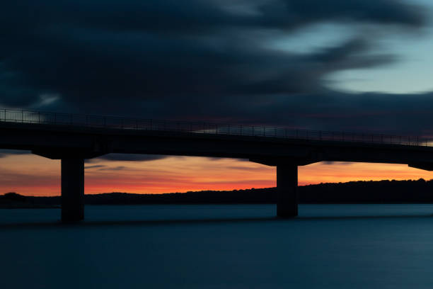 istock Nice sunset after a viaduct crossing over a lake 1134000706