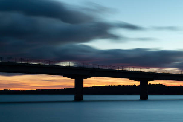 istock Nice sunset after a viaduct crossing over a lake 1134000713