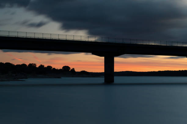 istock Nice sunset after a viaduct crossing over a lake 1134000715